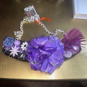 Statement necklace.  purple flower, feather and rhinestone, glitter